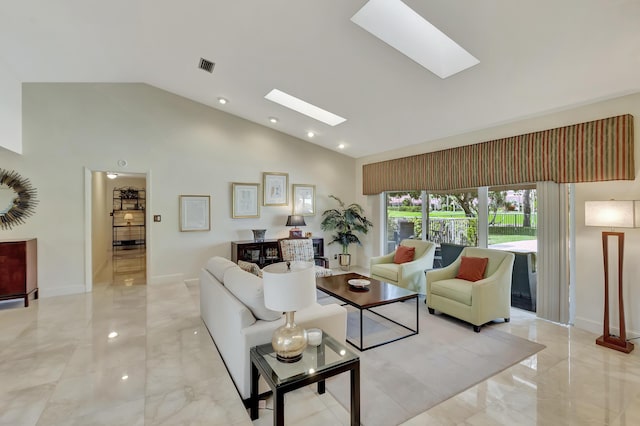 living room with a skylight and high vaulted ceiling