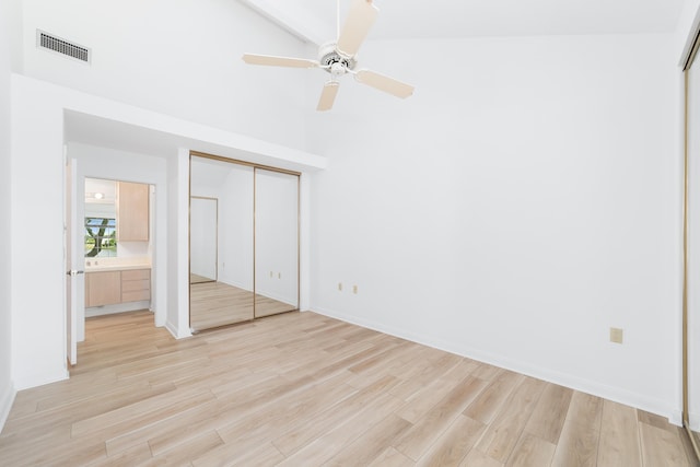 unfurnished bedroom with light hardwood / wood-style flooring, ceiling fan, and a closet