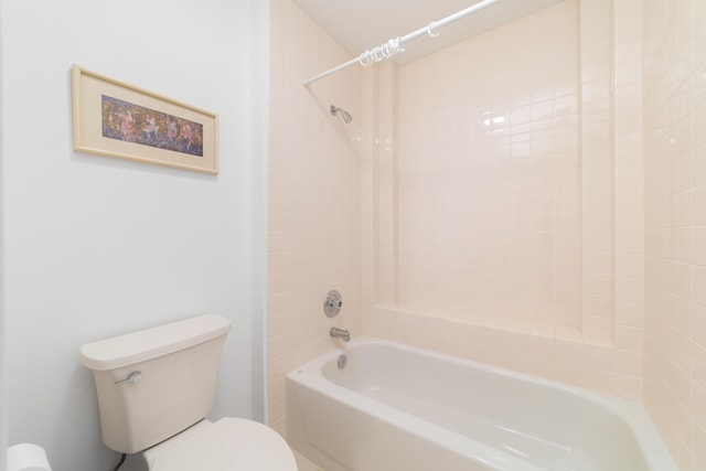 bathroom featuring bathing tub / shower combination and toilet