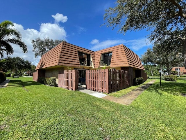 view of home's exterior featuring a lawn