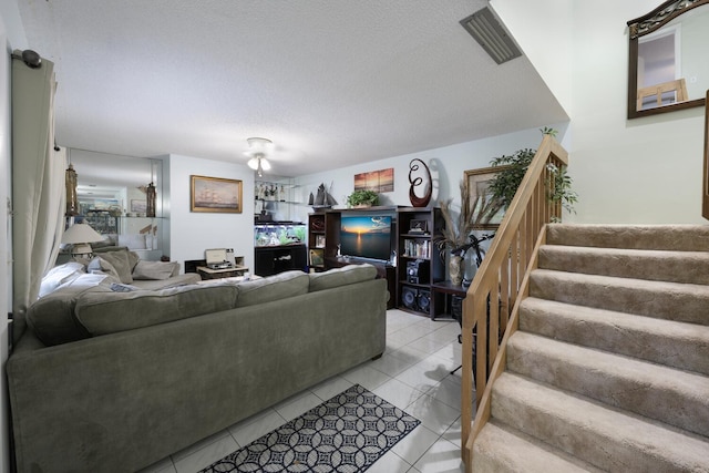 tiled living room with a textured ceiling