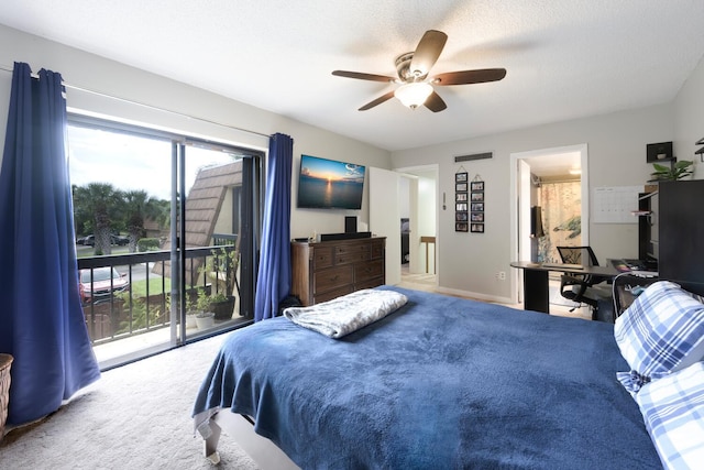 carpeted bedroom featuring access to outside, a textured ceiling, and ceiling fan