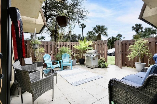 view of patio featuring a grill