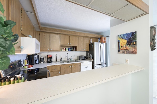 kitchen featuring white appliances and sink