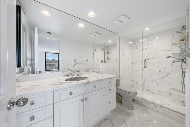 bathroom featuring an inviting chandelier, recessed lighting, a marble finish shower, and vanity