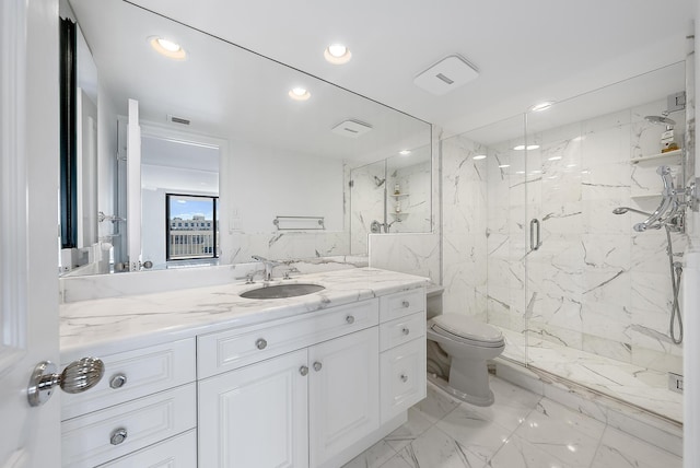 full bath featuring a marble finish shower, toilet, marble finish floor, vanity, and recessed lighting