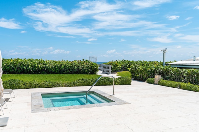 view of swimming pool with an in ground hot tub and a patio area