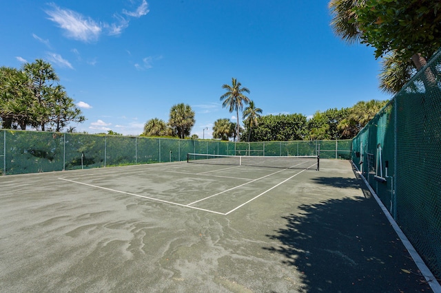 view of sport court with fence