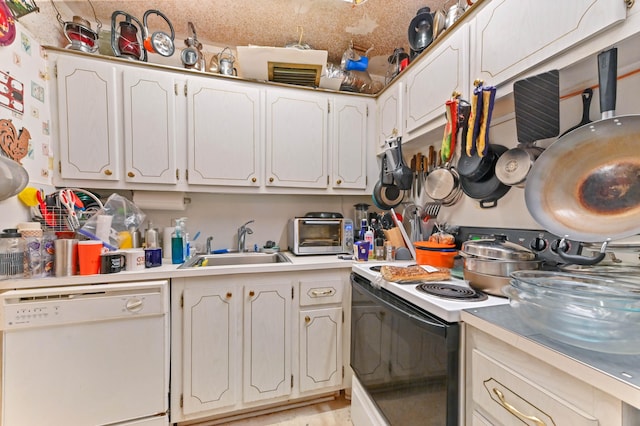 kitchen featuring white appliances, light hardwood / wood-style flooring, sink, and white cabinets