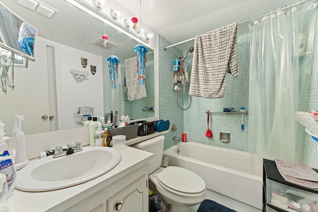 full bathroom featuring vanity, shower / bath combo, and toilet