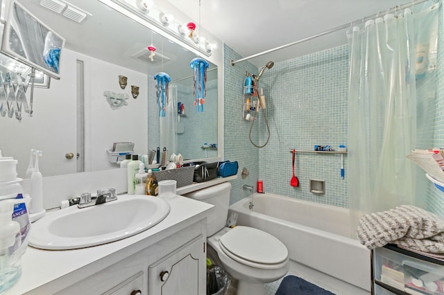 full bathroom featuring toilet, shower / tub combo with curtain, and vanity