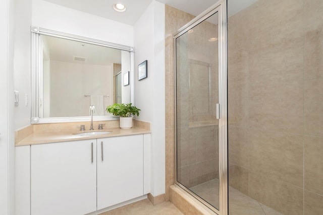 550 Okeechobee Blvd Unit 509, West Palm Beach, FL 33401 - bathroom featuring vanity, a stall shower, and tile patterned flooring