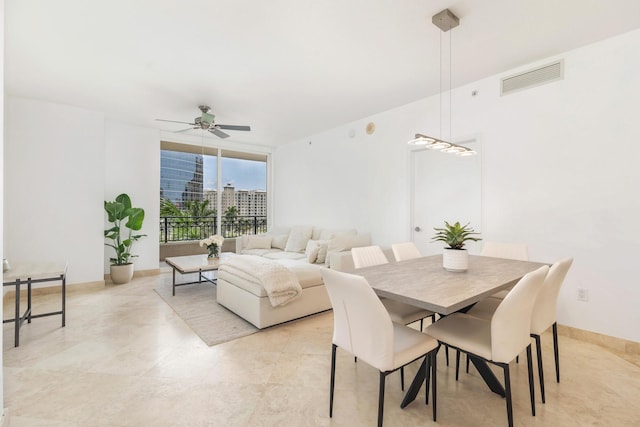 550 Okeechobee Blvd Unit 509, West Palm Beach, FL 33401 - dining room with a ceiling fan and expansive windows