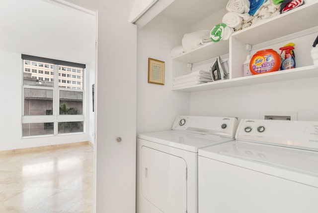 clothes washing area with laundry area and washing machine and dryer