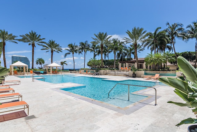 view of swimming pool with a gazebo and a patio