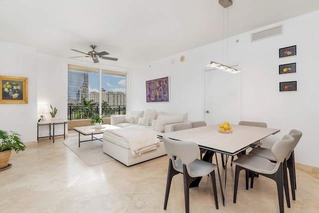 dining space featuring ceiling fan and visible vents