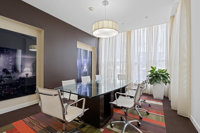 550 Okeechobee Blvd Unit 509, West Palm Beach, FL 33401 - dining area with plenty of natural light, baseboards, and dark carpet