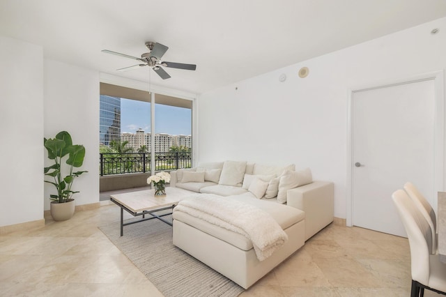 550 Okeechobee Blvd Unit 509, West Palm Beach, FL 33401 - living area with expansive windows and ceiling fan