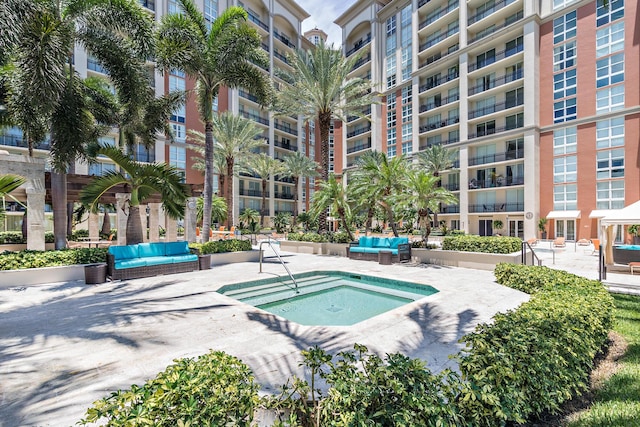 view of pool featuring an outdoor hangout area, a patio, and a community hot tub