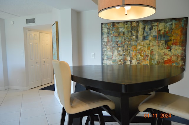 dining area featuring light tile patterned floors