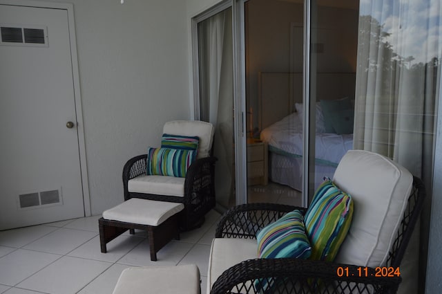 sitting room featuring light tile patterned floors