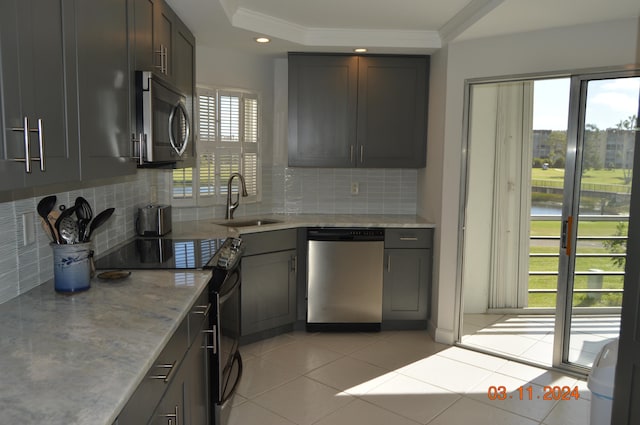 kitchen with sink, stainless steel appliances, and a wealth of natural light