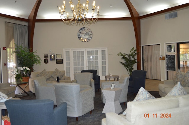 living room with beam ceiling, a notable chandelier, carpet flooring, and high vaulted ceiling