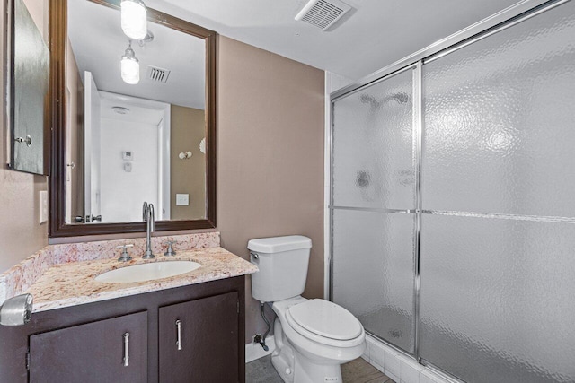 bathroom featuring toilet, walk in shower, and vanity