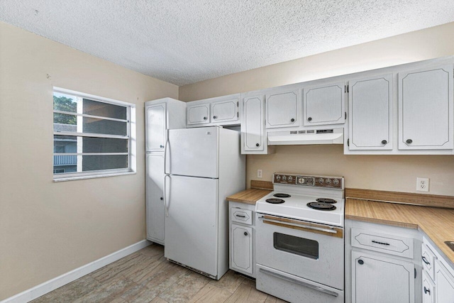 kitchen with a textured ceiling, white cabinets, light wood-type flooring, and white appliances