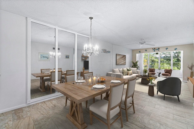 dining room featuring ceiling fan and a textured ceiling