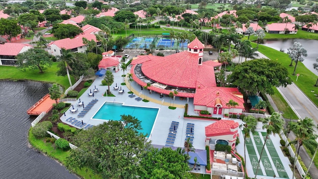 birds eye view of property with a water view