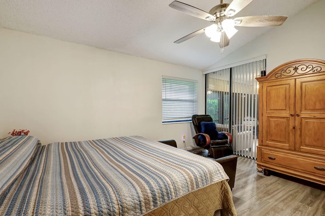 bedroom featuring access to exterior, ceiling fan, a textured ceiling, vaulted ceiling, and light wood-type flooring