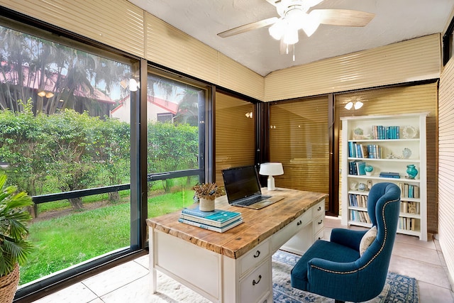 tiled office space featuring ceiling fan