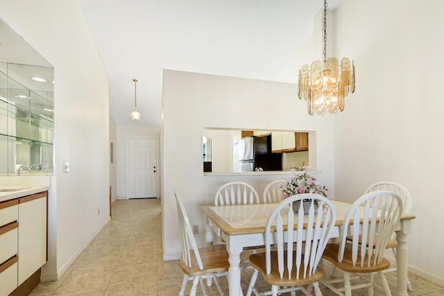 tiled dining room with an inviting chandelier