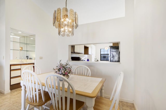 dining room with a notable chandelier and sink