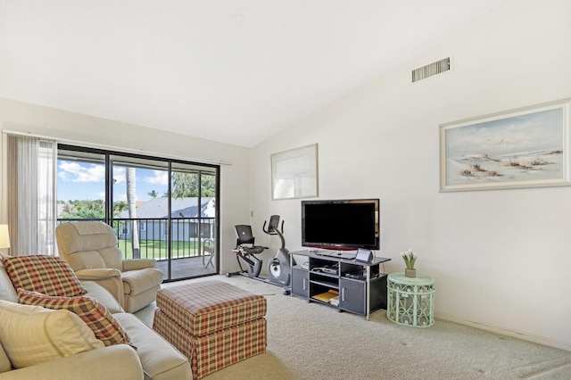 living room featuring vaulted ceiling and carpet flooring