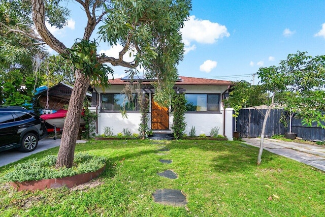 view of front of property with a front lawn