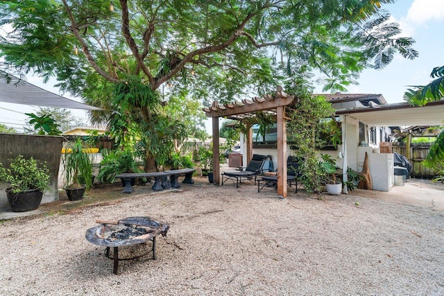 view of patio featuring an outdoor fire pit