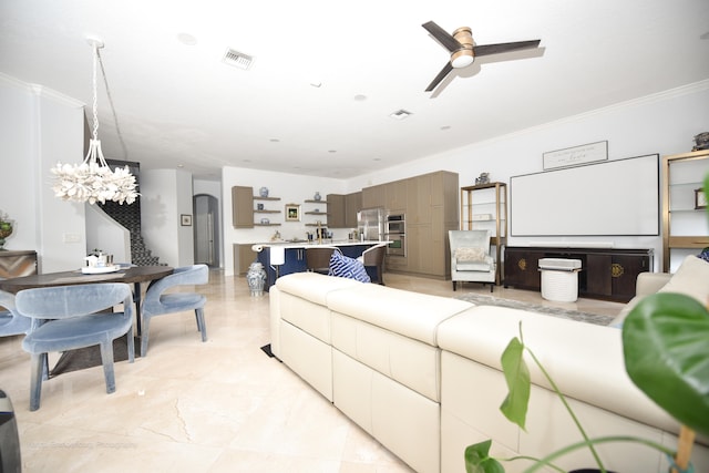 living room with crown molding and ceiling fan with notable chandelier