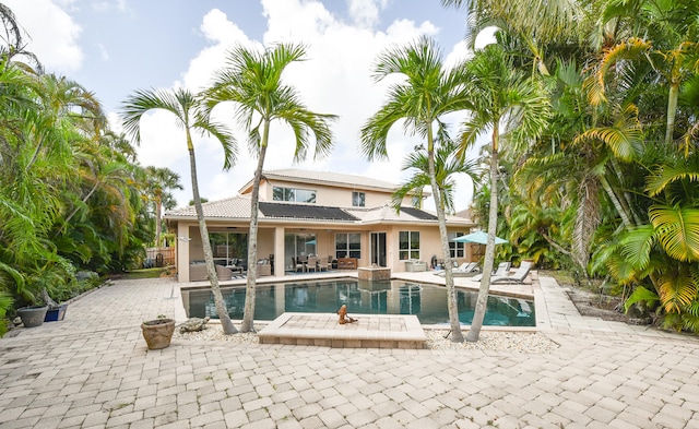 view of swimming pool featuring a patio