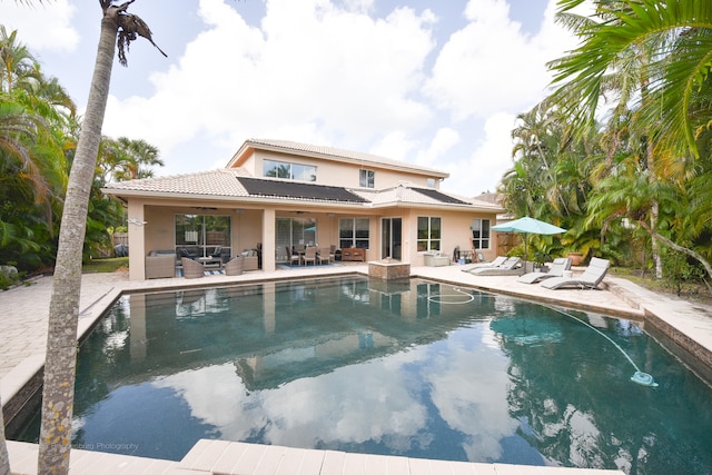 view of swimming pool featuring a patio and an outdoor hangout area