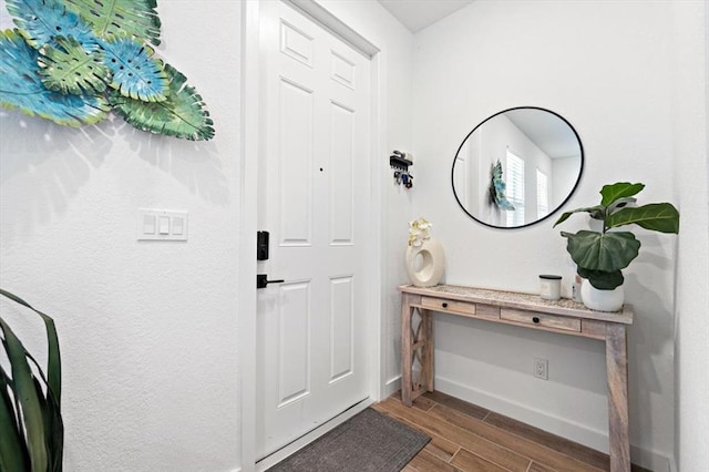 foyer with dark hardwood / wood-style floors