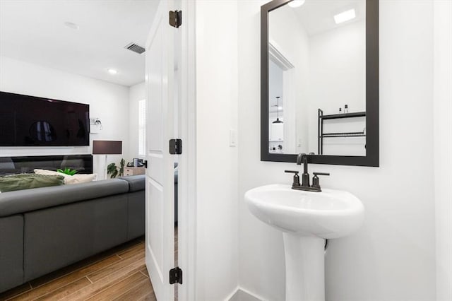 bathroom featuring wood-type flooring