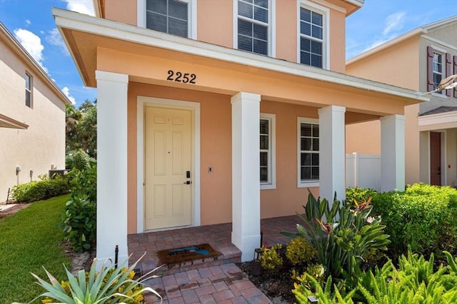 property entrance featuring covered porch