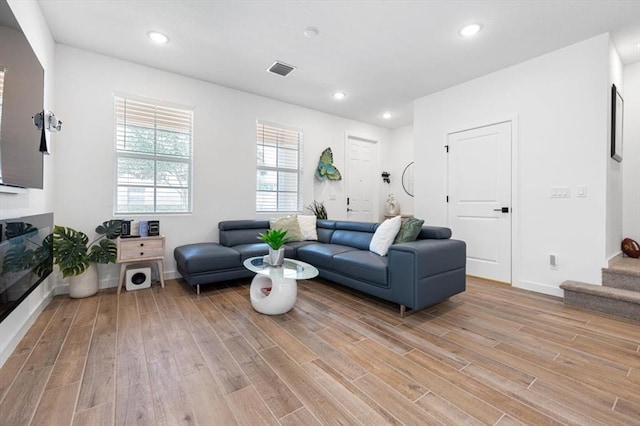 living room with light hardwood / wood-style flooring