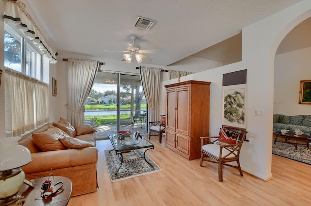 living room featuring ceiling fan, a healthy amount of sunlight, and light hardwood / wood-style floors