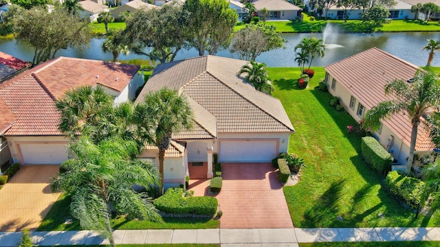 birds eye view of property featuring a water view