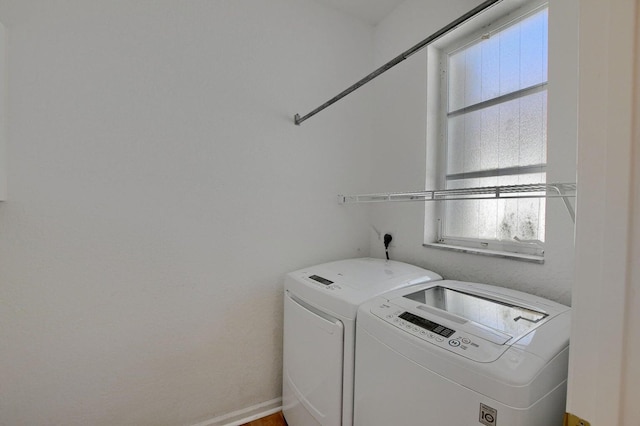 laundry room with washing machine and dryer