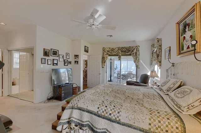 bedroom with access to outside, multiple windows, ceiling fan, and carpet