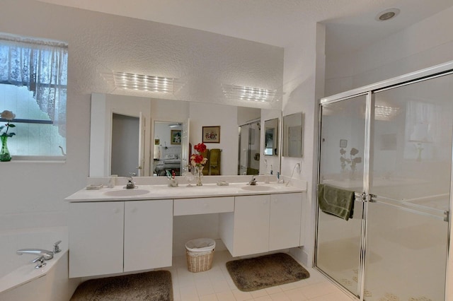 bathroom featuring tile patterned floors, vanity, and plus walk in shower